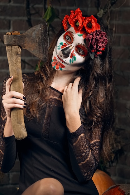 Female sugar skull makeup. Face painting art.