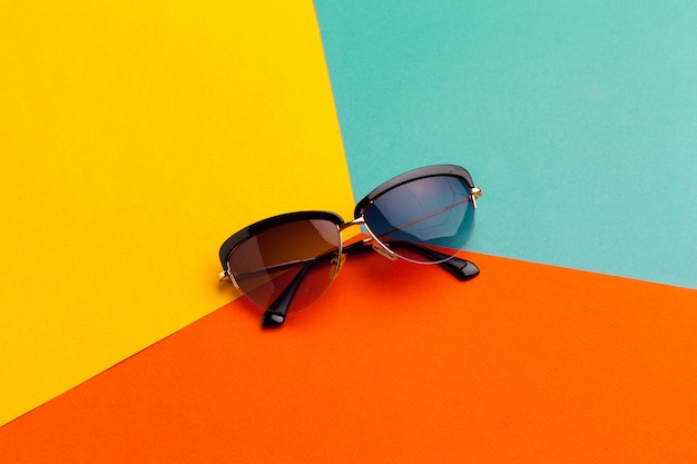 Female sunglasses on a colorful vibrant 