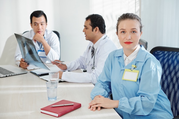 Female surgeon attending meeting