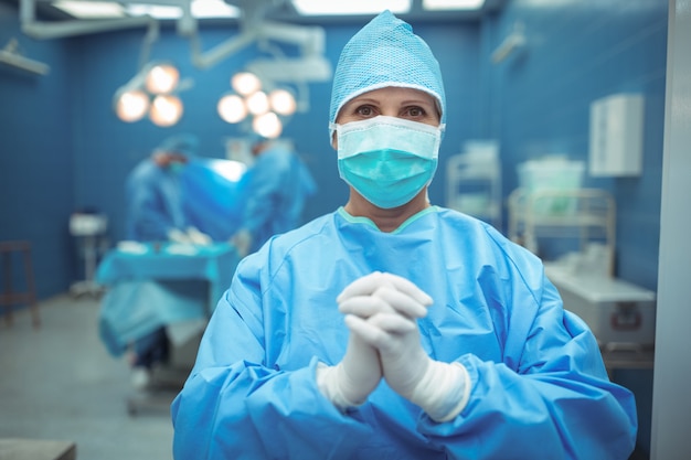 Female surgeon praying in operation theater