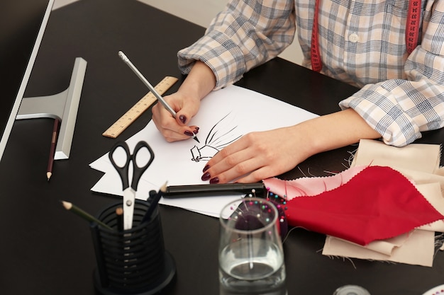 Female tailor working in atelier