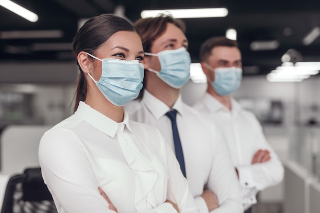 Female team leader in medical mask