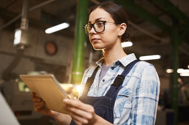 Female technician using tablet pc