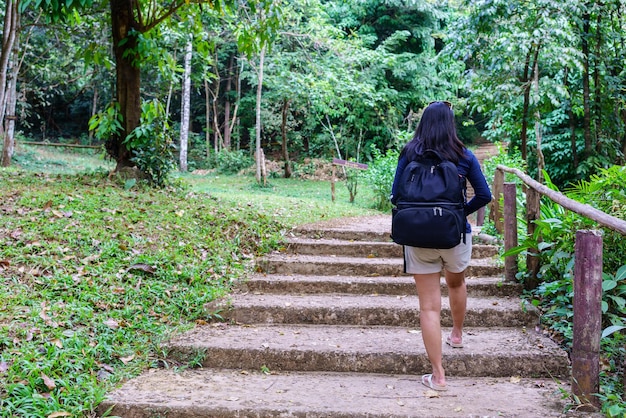 Female touist walking around in National park in Thailand