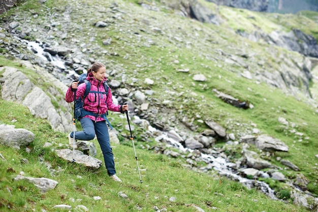 Female tourist hiking in the mountains