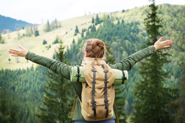 Female tourist in mountains