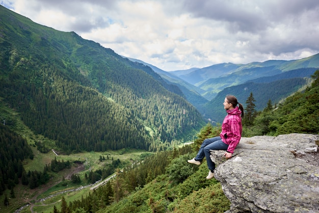 female tourist on rock edge