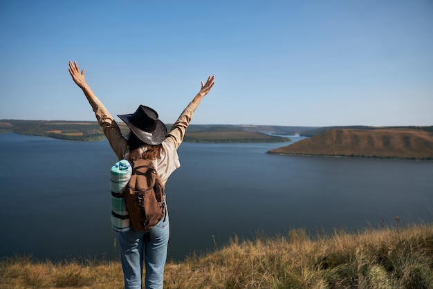 Female tourist standing on hill at bakota bay