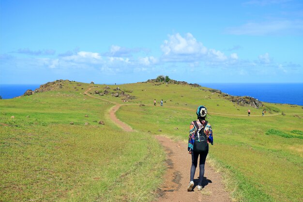 Female Tourist Visiting Orongo Village, the Historic Ceremonial Center on Easter Island, Chile