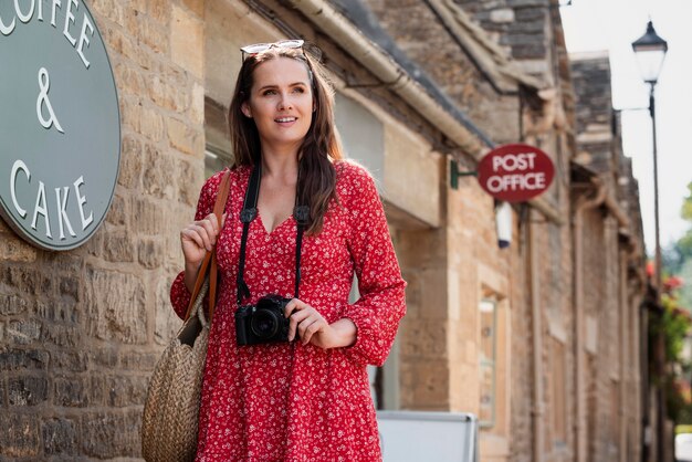 Female traveler having a professional camera for new memories