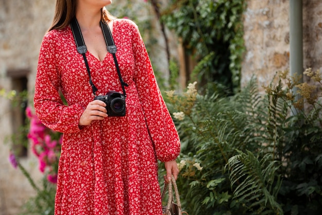 Female traveler using a professional camera for new memories