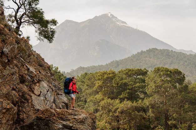 Female traveller climbs on hills in Turkey