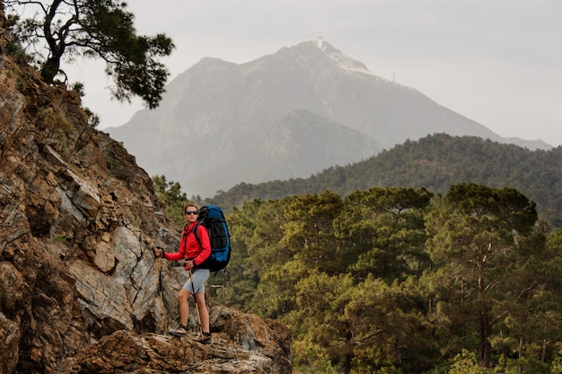 Female traveller hikes on hills in Turkey