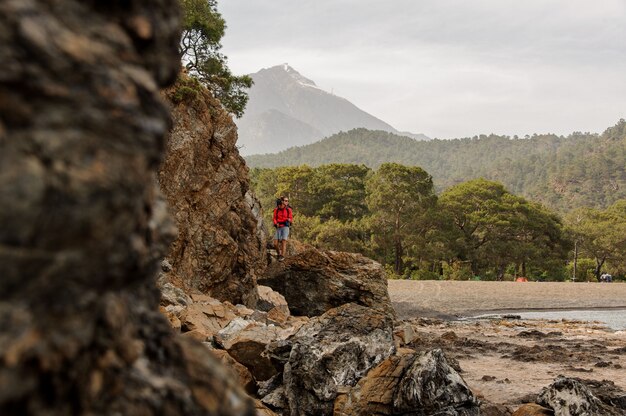 Female trekker standing on hills in Turkey