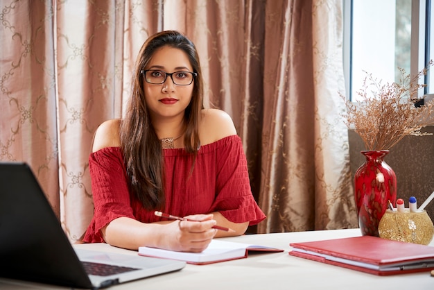 Female university student doing homework