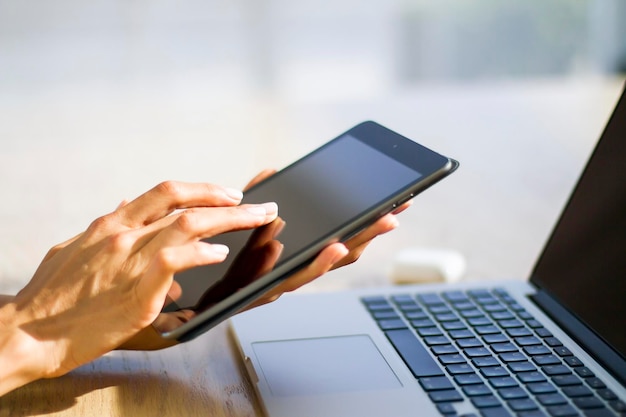 Female using a digital tablet close up