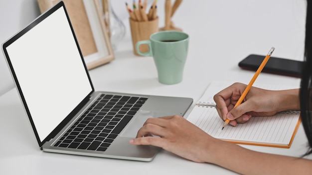 female using her laptop with empty screen