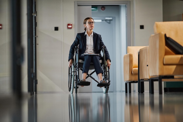 Female Wheelchair User in Office