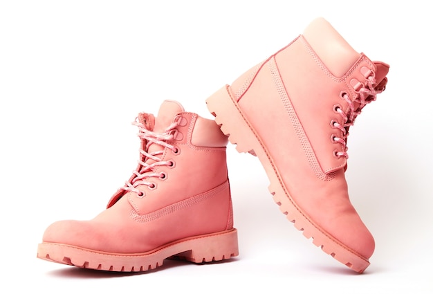 Female winter boots pink color isolated on white womens shoes