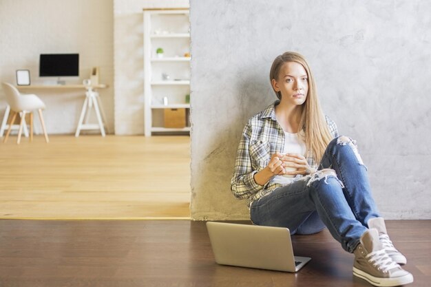 Female with coffee in interior