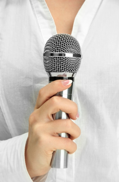 Female with microphone, close up