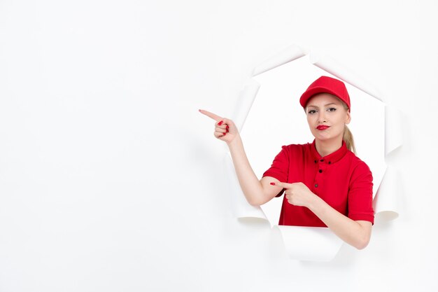 Female worker in red uniform on white