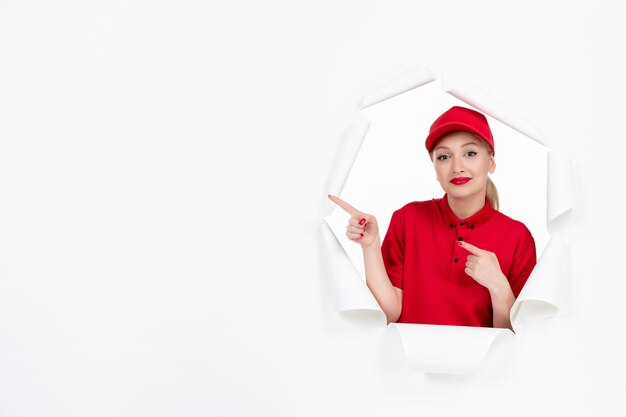 Female worker in red uniform on white