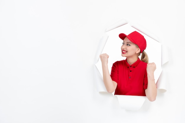 Female worker in red uniform on white