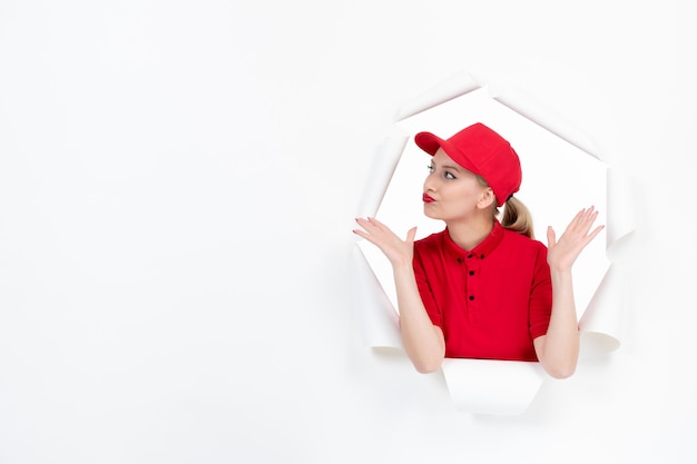 Female worker in red uniform on white