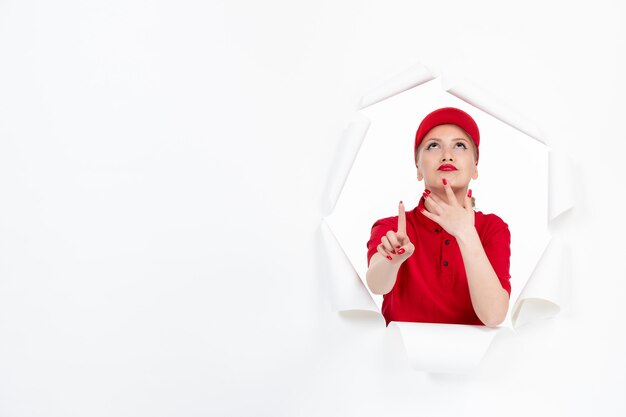 Female worker in red uniform on white