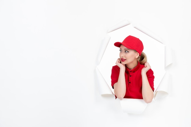 Female worker in red uniform on white