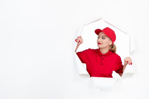 Female worker in red uniform on white