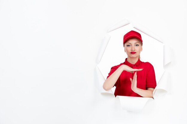 Female worker in red uniform on white