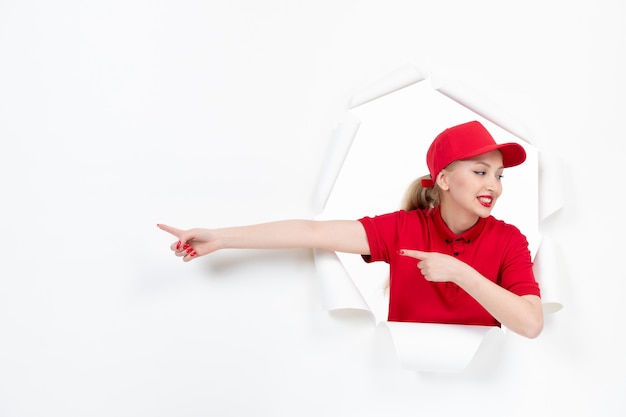 Female worker in red uniform on white