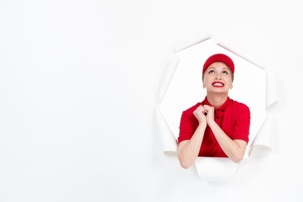 Female worker in red uniform on white