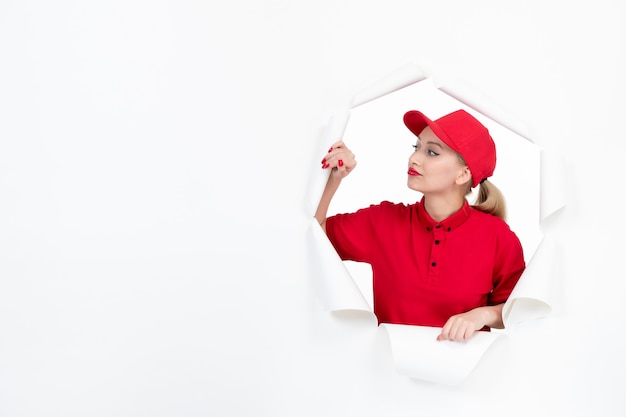 Female worker in red uniform on white