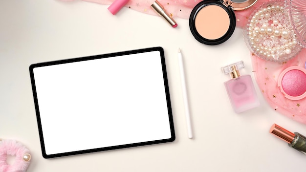 Female workspace feminine office desk with tablet white screen mockup