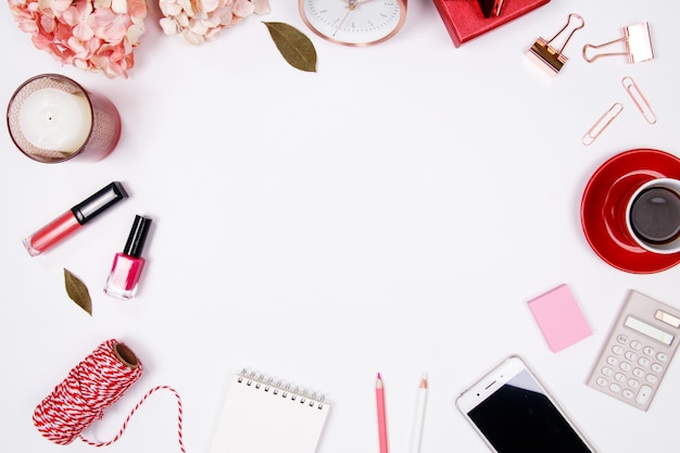 Feminine desk workspace on white background