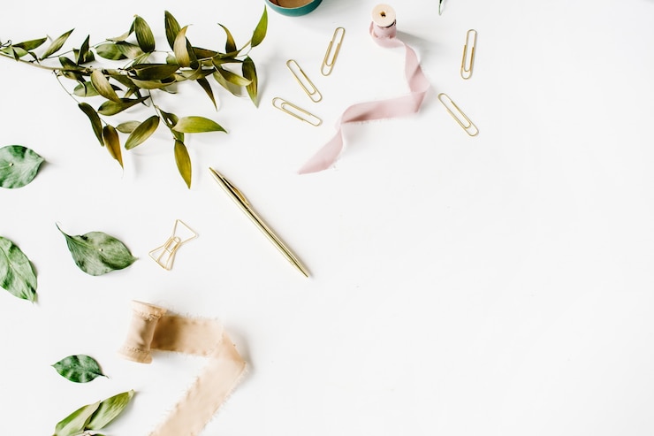 Photo feminine home office workspace mockup with branches, golden pen, clips and beige ribbon