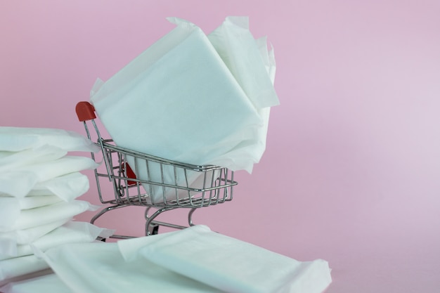 Feminine sanitary napkin on pink background