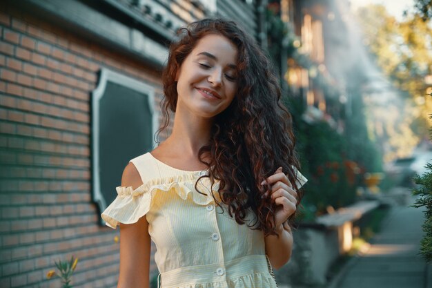 Feminine woman portrait of young pretty trendy woman posing