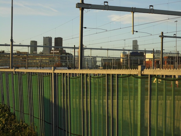 Photo fence against cityscape