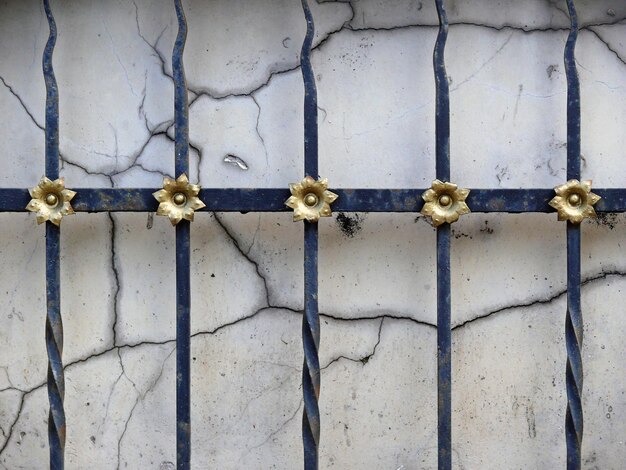 Photo fence against cracked wall