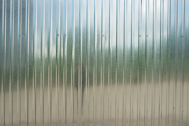 Fence made of new shiny corrugated board