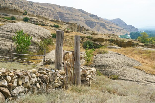 Fence made of stone and wooden fence