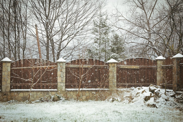 Fence in snowy day in Carpathian mountains