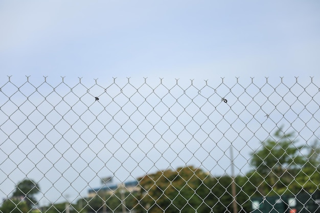 A fence with a fence that has a hole in it