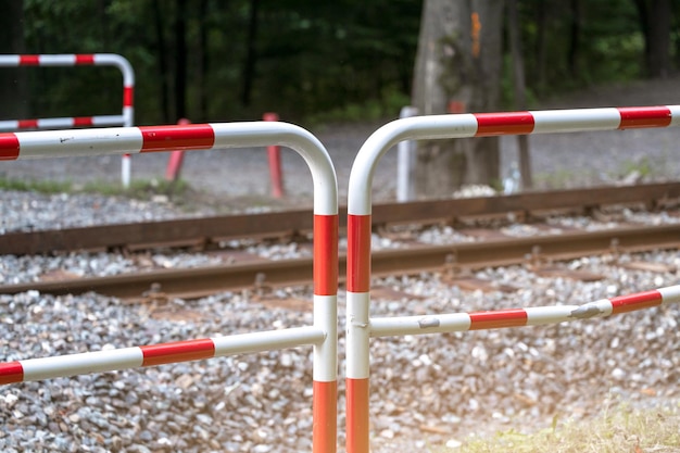 Fences near the railway prohibiting passage through the rails