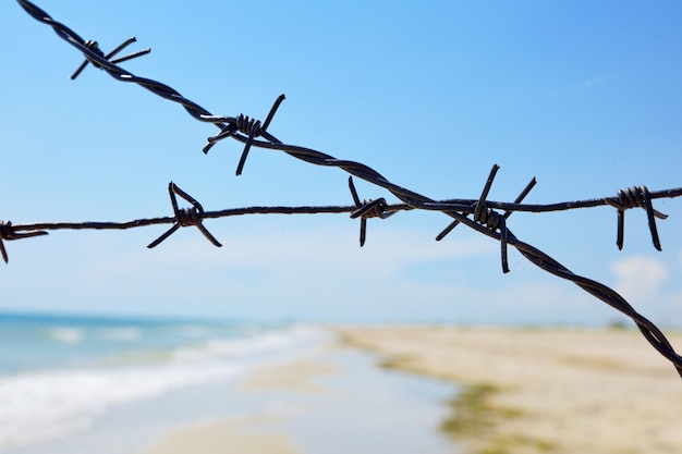 Fencing of the sea shore with barbed iron wire