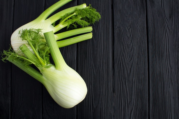 Fennel on the black wooden background